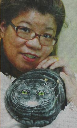 Малазийская художница Suzi Chua, портреты животных на камнях